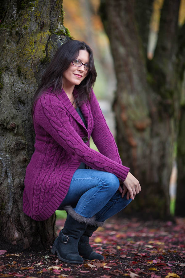 portrait woman in oregon park wearing purple sweater