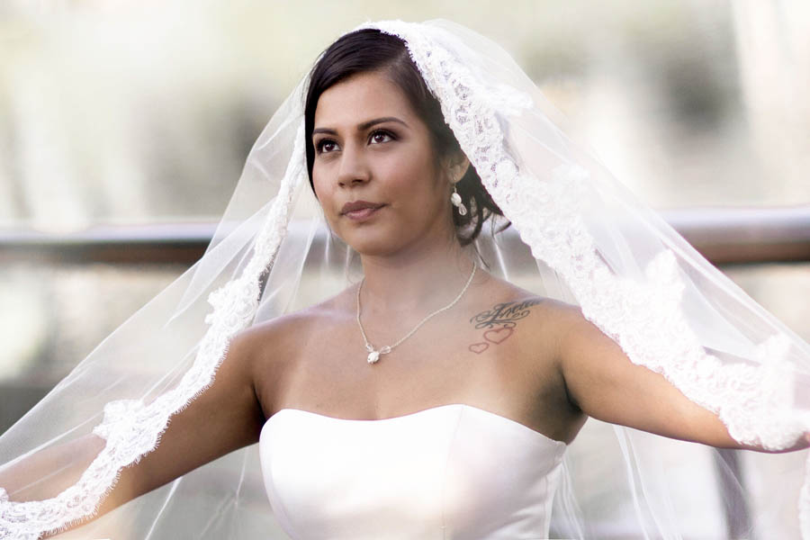 hispanic wedding bride with veil reaching