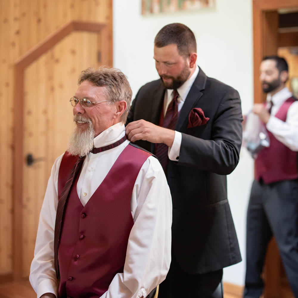 groomsmen dressing before wedding ceremony